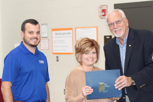 Pam Richard, Maintenance Department, receiving a recognition from Mike Almaroad and Mr. Johnathon Shatus 