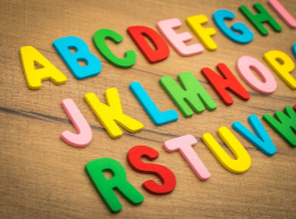 colorful letters displayed on wood